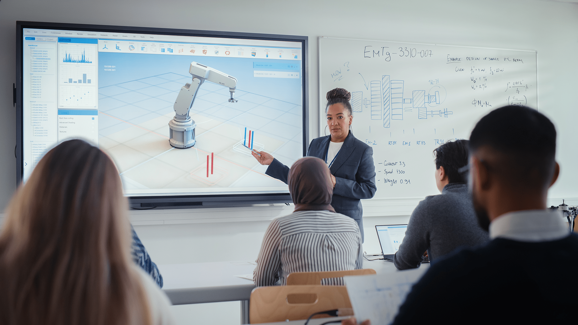 A woman presents a robotics simulation on a large screen to attentive students with laptops; diagrams adorn the whiteboard.