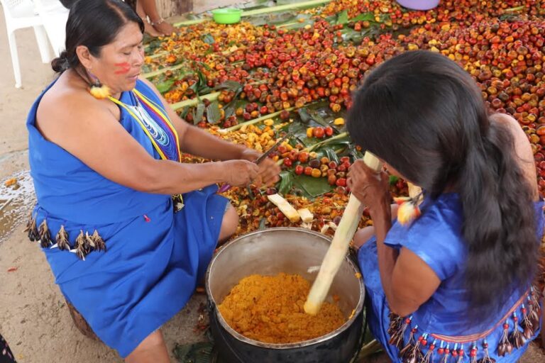 Shuar women preparing food