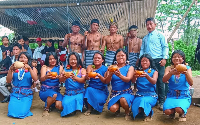 Shuar group holding bowls